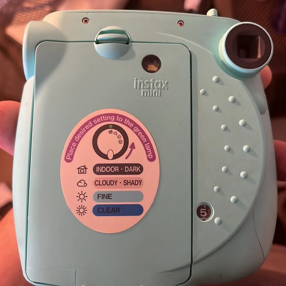 Polaroid camera made by Fujifilm called the Instax mini 7s